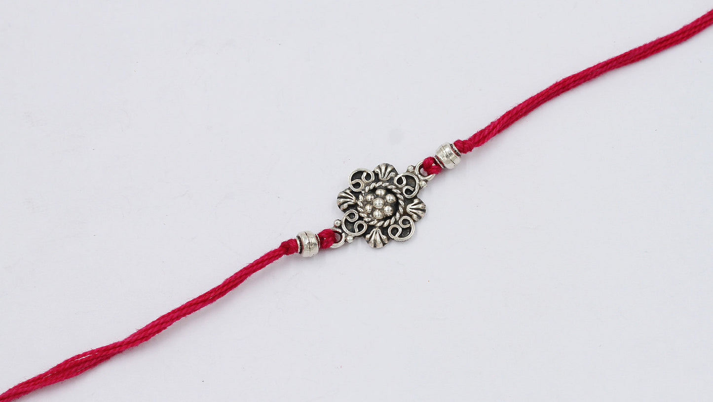 Traditional Silver Rakhi with Swastika Design