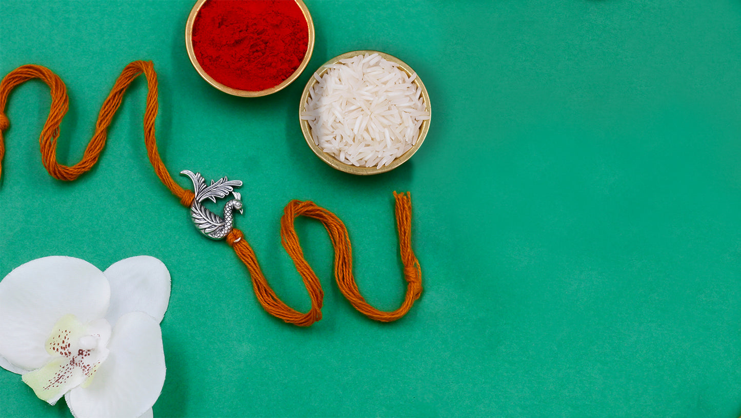 Graceful Peacock Silver Rakhi | Sangeeta Boochra