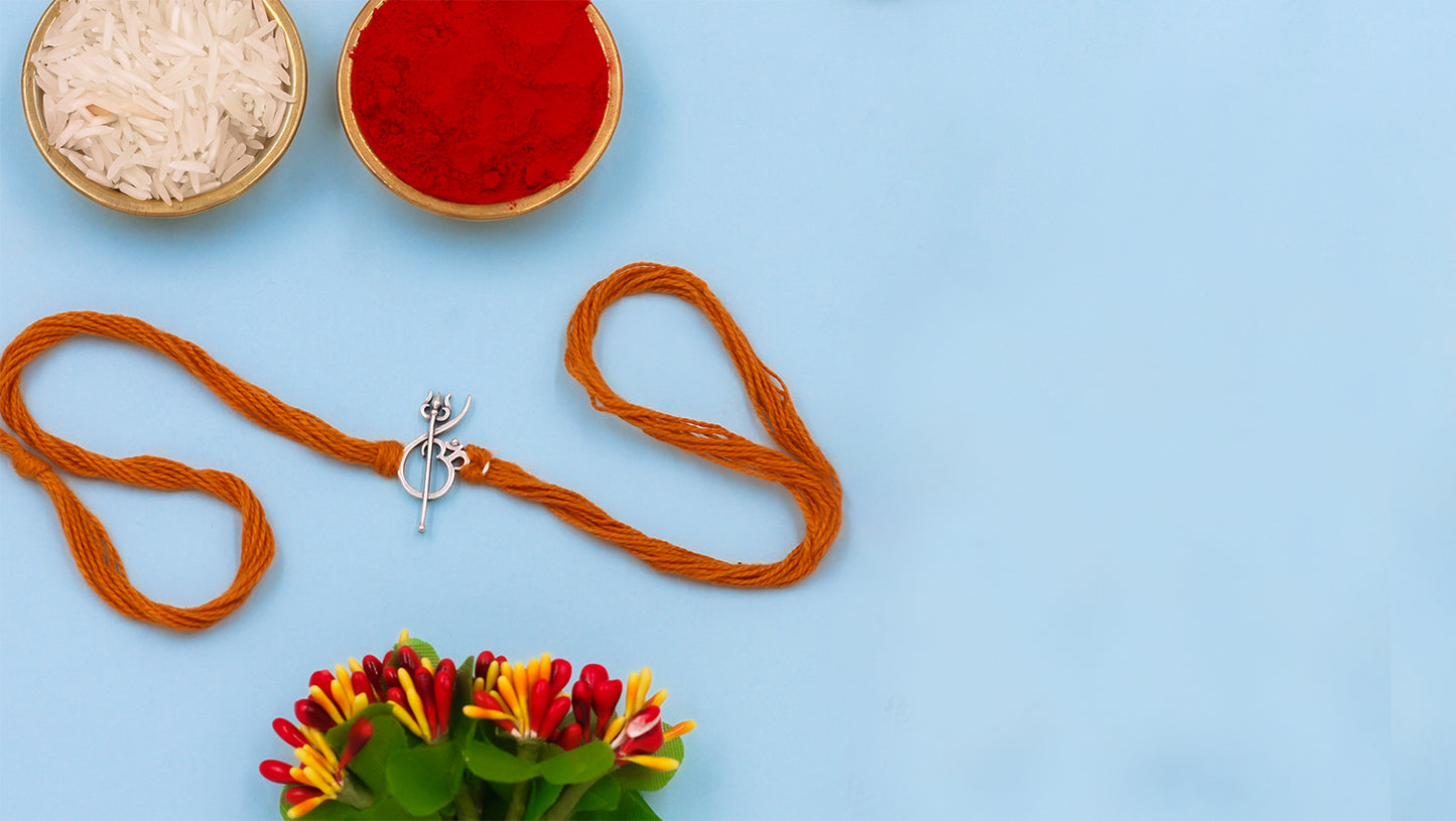 Divine Shield Silver Rakhi by Sangeeta Boochra