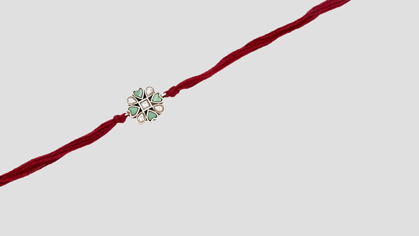 Floral Bond Silver Rakhi By Sangeeta Boochra