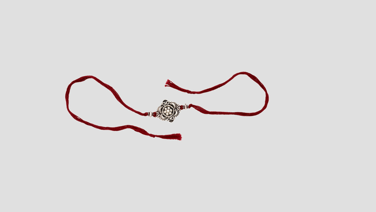 Elegant Red Thread Rakhi with Silver Charm