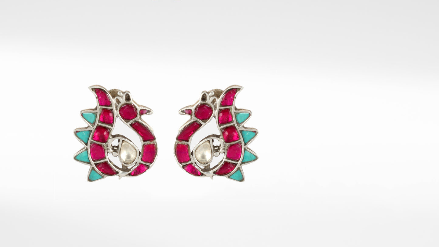 Beautiful Peacock designed silver earrings with semi precious gemstones and kundans. Front photo