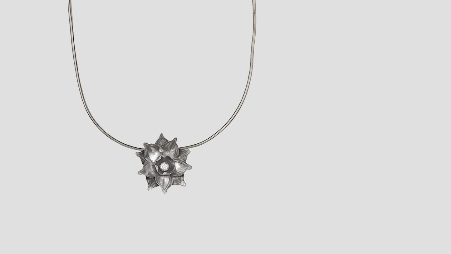 Sangeeta Boochra Elegant Oxidised Silver Floral Radiance Pendant