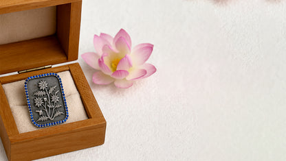 Sangeeta Boochra Timeless Floral Oxidised Silver Brooch with Blue Accents