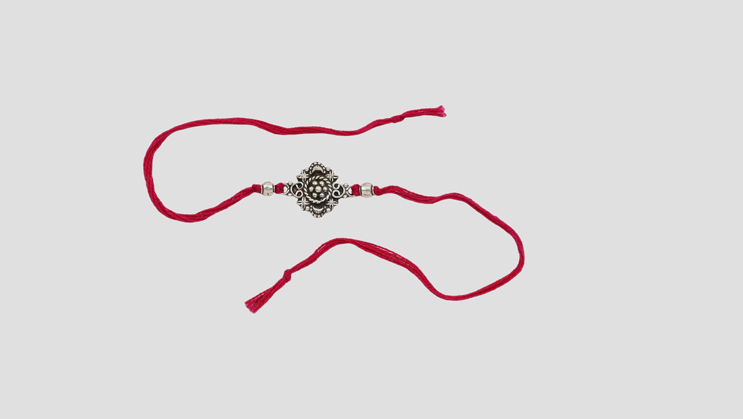 Royal Bloom Silver Rakhi by Sangeeta Boochra