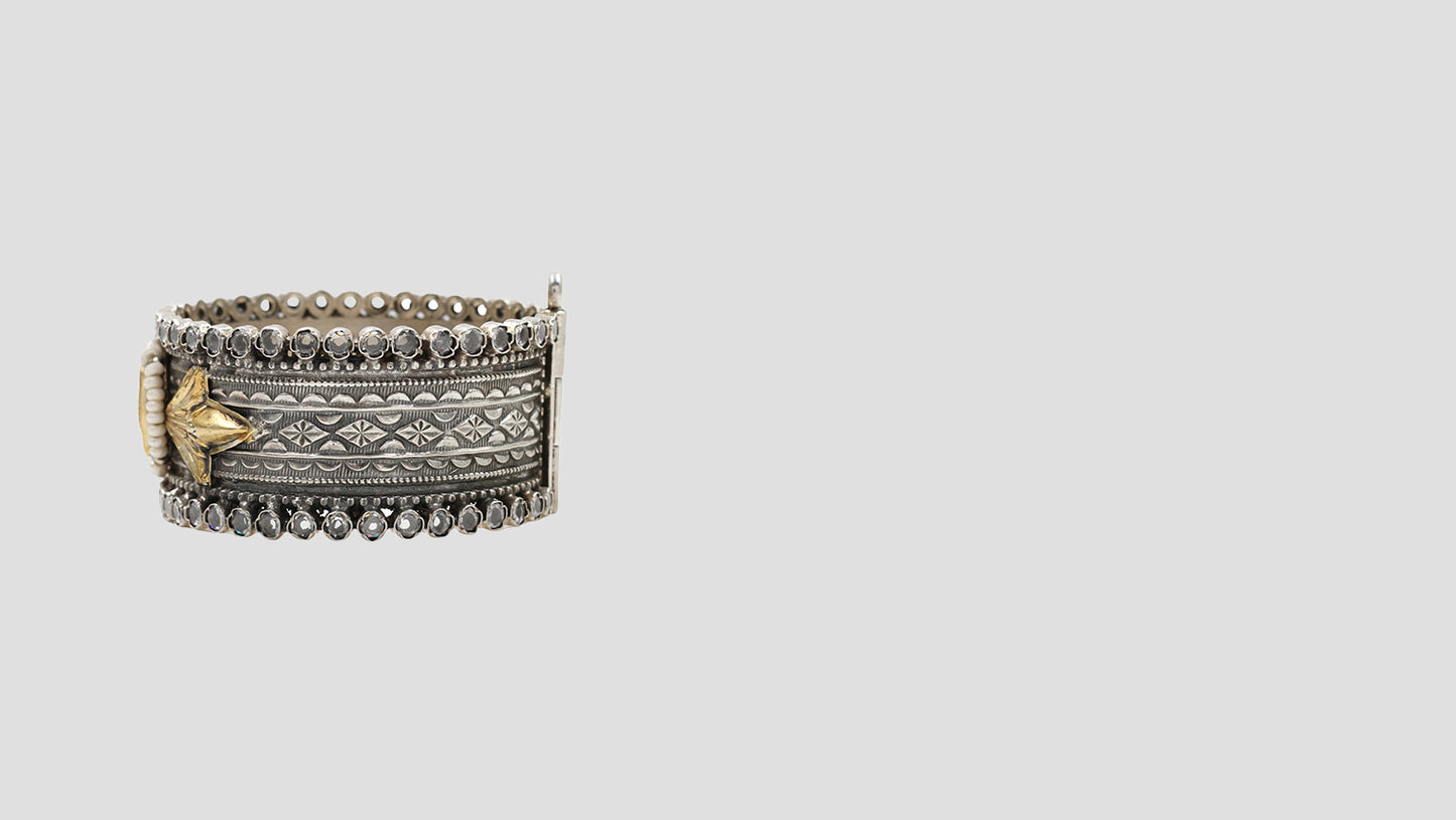 Regal Grace: Handcrafted Silver Bangle with Gold Leaf Detailing