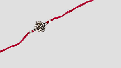 Royal Bloom Silver Rakhi by Sangeeta Boochra
