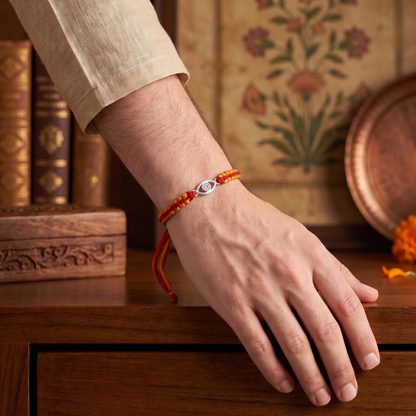 925 Sterling Silver Evil Eye Rakhi with Red & Orange Thread | Sangeeta Boochra