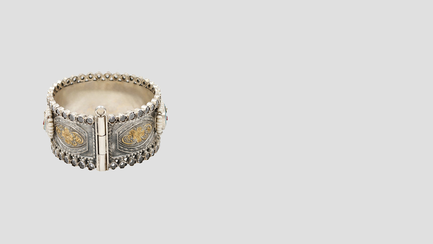 Heritage Glow: Handcrafted 925 Silver Bangle with Gold Floral Details