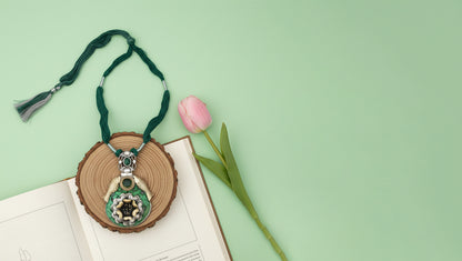 Sangeeta Boochra Artistic Silver Pendant with Green Stone & Floral Motif