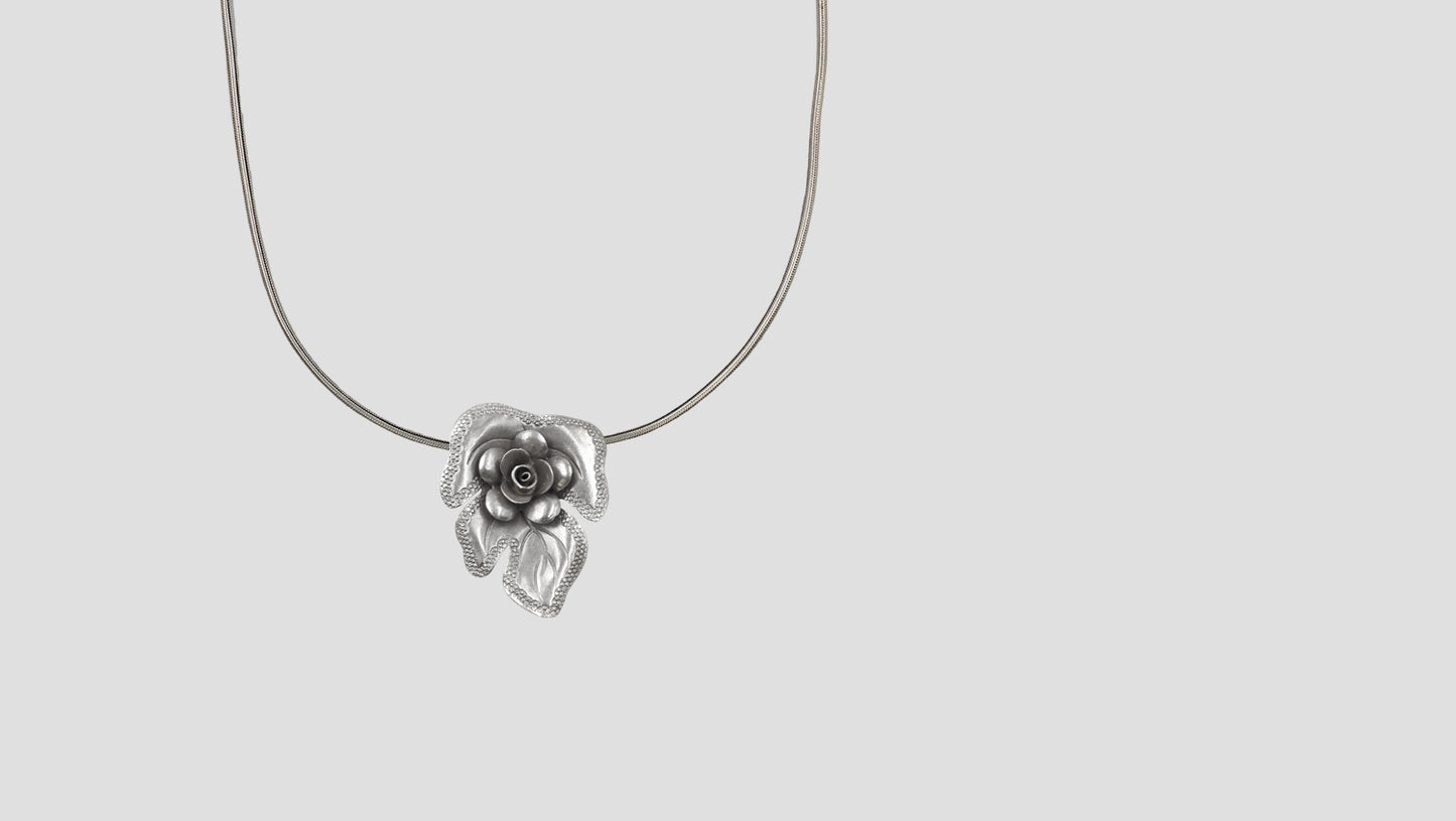 Handcrafted Oxidised Silver Flower Pendant by Sangeeta Boochra
