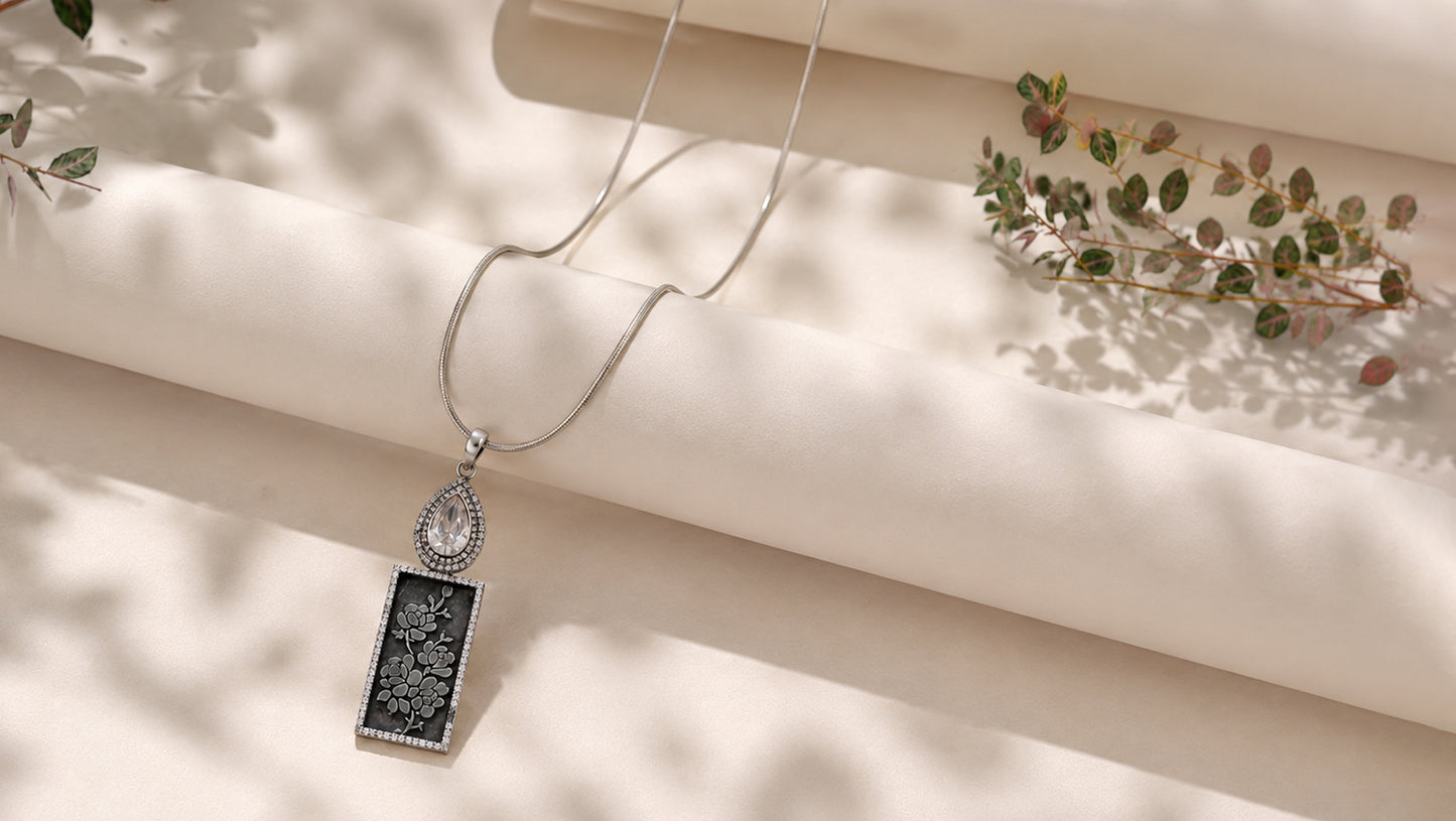 Sangeeta Boochra Designer Oxidised Silver Pendant with Floral Engraving & Moissanite
