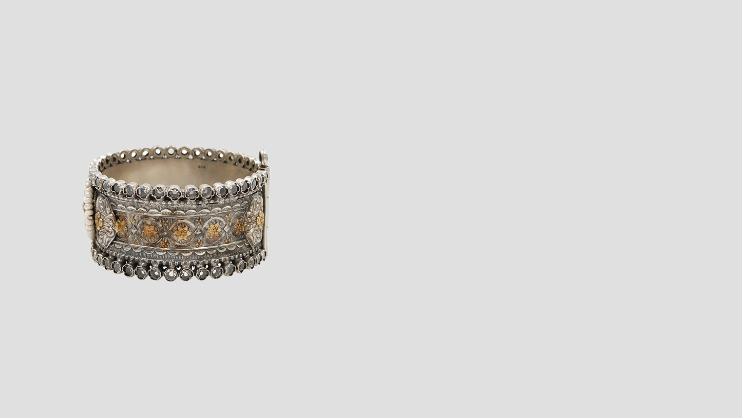 Heritage Glow: Handcrafted 925 Silver Bangle with Gold Floral Details