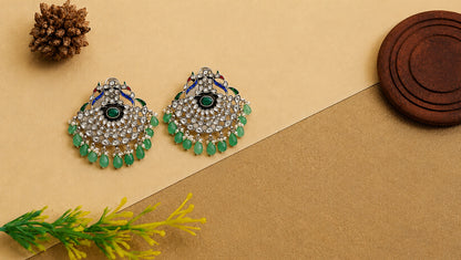 Sangeeta Boochra Handcrafted Peacock Motif Kundan Silver Earrings with Green Bead Drops