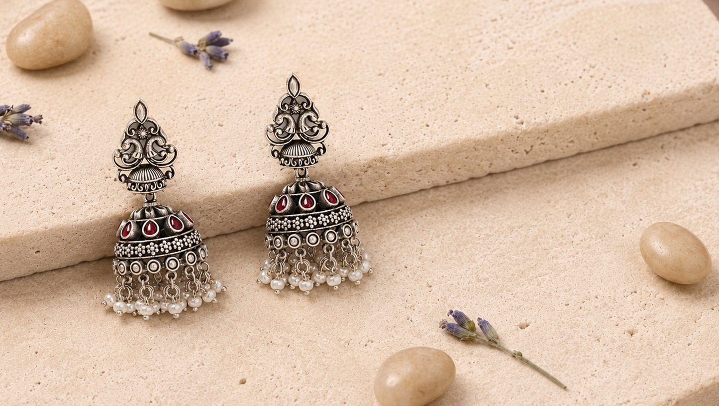 Sangeeta Boochra Peacock Motif Silver Jhumka Earrings with Ruby Kundan Stones & Pearl Hangings