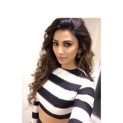 Daisy Shah in Silver Earrings