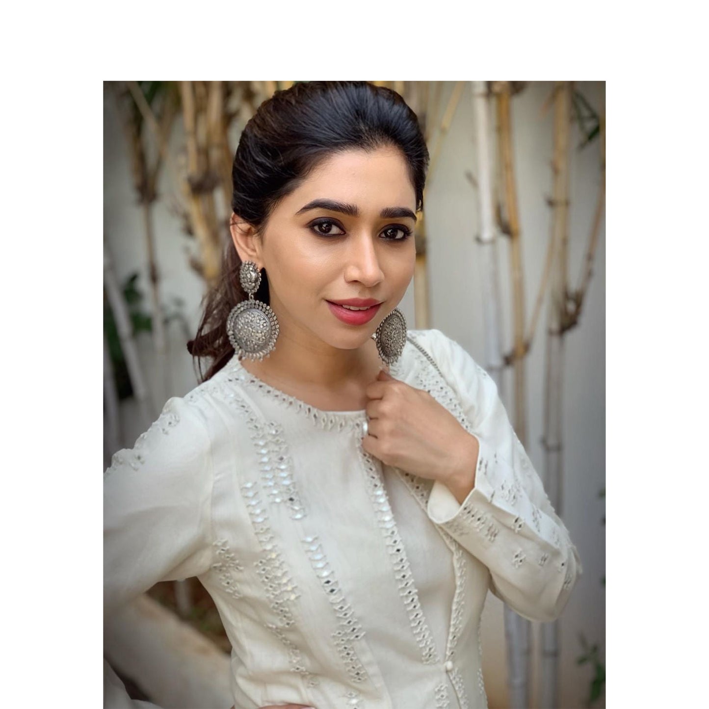 Aarti Ravi in Silver Earrings