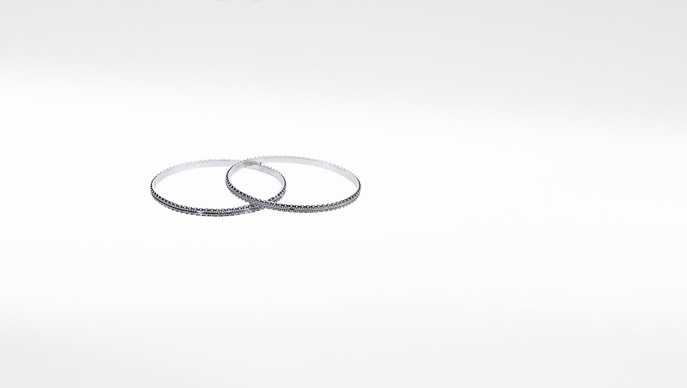 Designer silver bangle pair