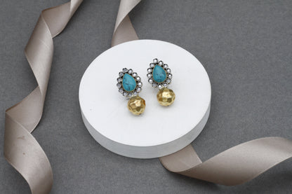 Deliberately handcrafted turquoise gemstone embellished silver earring