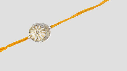 Golden Glow Silver Rakhi By Sangeeta Boochra