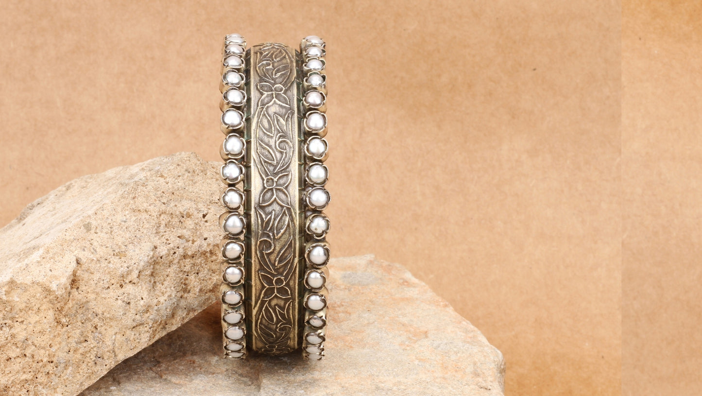 Elegant Floral Sabrina Silver Bracelet featuring intricate floral patterns