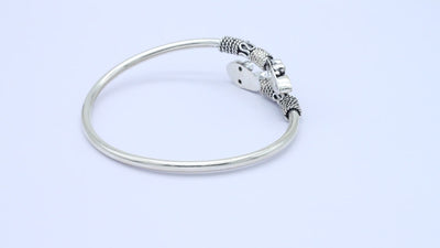 Free size silver designer bangle embellished with mix gemstone